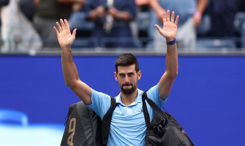 Serbia's Novak Djokovic waves as he leaves the court after losing the men's singles semifinal tennis match against Spain's Carlos Alcaraz on day thirteen of the US Open tennis tournament at the USTA Billie Jean King National Tennis Center in New York City, on September 5, 2025.  CHARLY TRIBALLEAU / AFP
