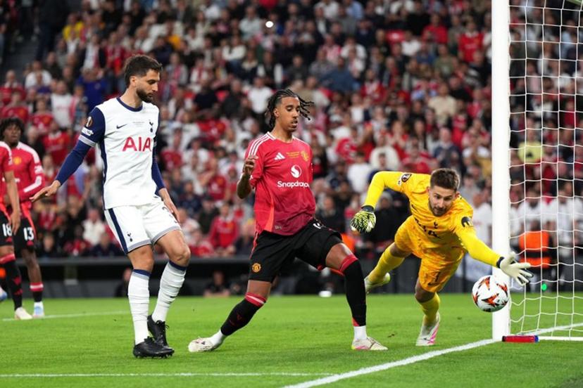 Tottenham Hotspur's Spanish defender #03 Sergio Reguilon, Manchester United's Danish defender #13 Patrick Dorgu and Tottenham Hotspur's Italian goalkeeper #01 Guglielmo Vicario vie for the ball during the UEFA Europa League final football match between Tottenham Hotspur and Manchester United at San Mames stadium in Bilbao on May 21, 2025.  Cesar Manso / AFP