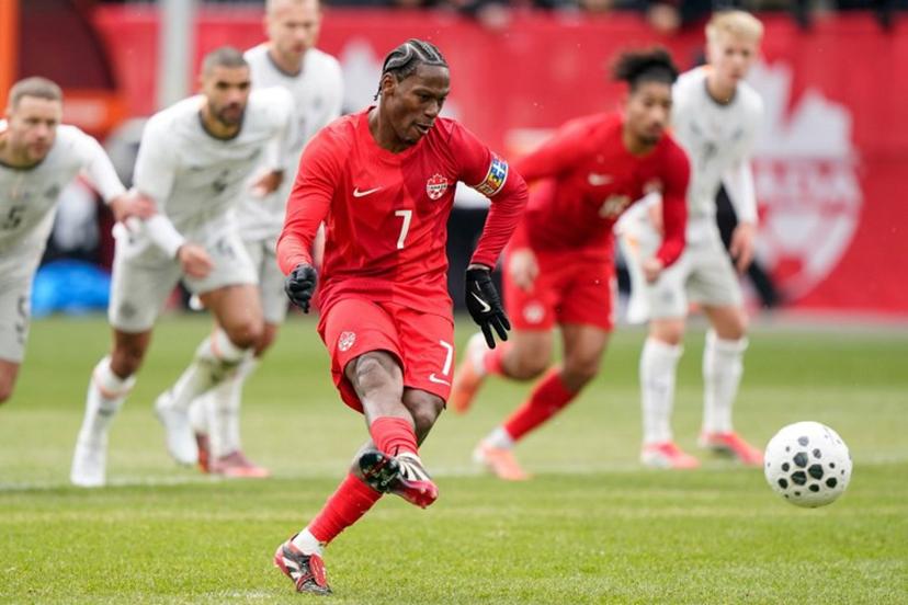Canada's forward #07 Jonathan David takes a penalty kick and scores a goal during a friendly football match between Canada and Iceland at BMO Field in Toronto, Canada, on March 28, 2026.  Geoff Robins / AFP