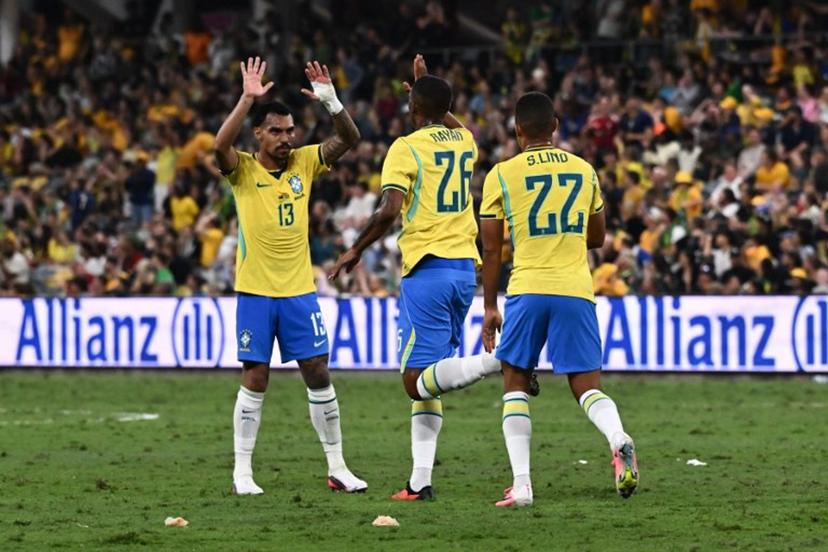 Brazil's Rayan Vitor Simplício Rocha (C) celebrates with Brazil's Matheuzinho (L) after scoring a goal during the International friendly football match between Australia and Brazil at Queensland Country Bank Stadium in Townsville on September 25, 2026.  SAEED KHAN / AFP