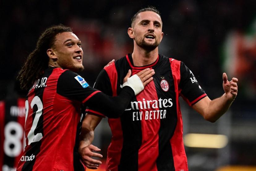 AC Milan's French midfielder #12 Adrien Rabiot (R) celebrates with AC Milan's Belgian midfielder #22 Diego Moreira after scoring his team's second goal during the Italian Serie A football match between AC Milan and Atalanta at the San Siro Stadium in Milan on October 18, 2026.  Piero CRUCIATTI / AFP