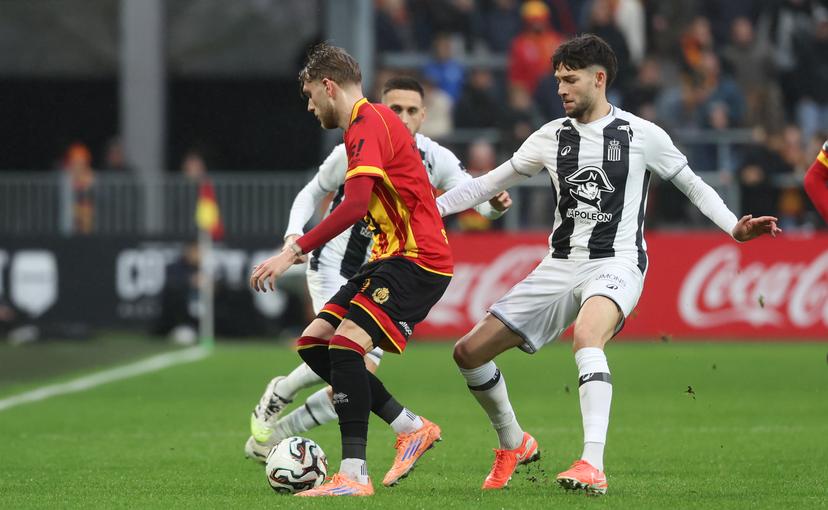 Mechelen's Mathis Servais and Charleroi's Antoine Colassin fight for the ball during a soccer match between KV Mechelen and Sporting Charleroi, Sunday 07 December 2025 in Mechelen, on day 17 of the 2025-2026 'Jupiler Pro League' first division of the Belgian championship. BELGA PHOTO VIRGINIE LEFOUR