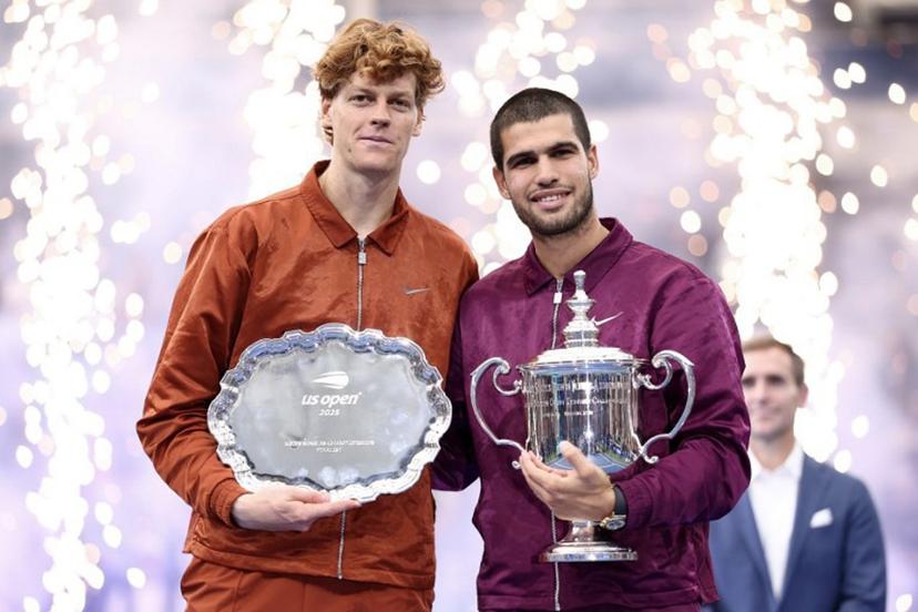 Spain's Carlos Alcaraz (R) and Italy's Jannik Sinner (L) pose for a photo after their men's singles final tennis match on day fifteen of the US Open tennis tournament at the USTA Billie Jean King National Tennis Center in New York City, on September 7, 2025. Carlos Alcaraz beat Jannik Sinner in four sets on Sunday to win the US Open as loud boos -- mixed with a smattering of cheers -- greeted President Donald Trump at the final in New York.  CHARLY TRIBALLEAU / AFP