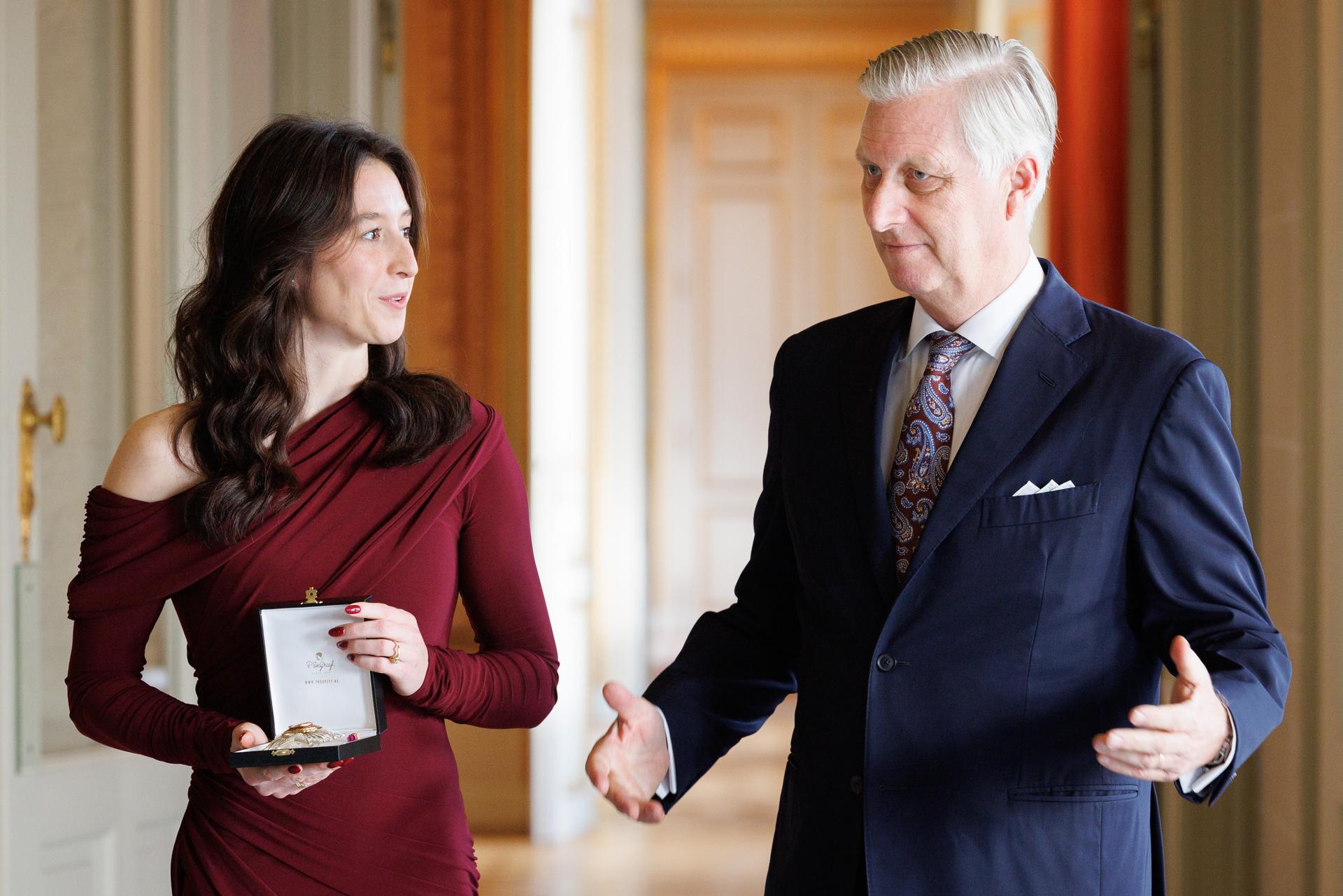 Former gymnast Nina Derwael and King Philippe - Filip of Belgium pictured during a ceremony to award the 'Order of Leopold' (Grootofficier in de Leopoldsorde - Grand Officier de l'Ordre de Leopold) distinction, at the Royal Castle in Laken - Laeken, Brussels, on Tuesday 09 December 2025. Today the honorary order of knighthood is awarded to retired gymnast Derwael, the 2020 Olympic champion, two-time World champion, and three-time European champion. BELGA PHOTO BENOIT DOPPAGNE