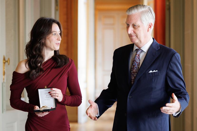 Former gymnast Nina Derwael and King Philippe - Filip of Belgium pictured during a ceremony to award the 'Order of Leopold' (Grootofficier in de Leopoldsorde - Grand Officier de l'Ordre de Leopold) distinction, at the Royal Castle in Laken - Laeken, Brussels, on Tuesday 09 December 2025. Today the honorary order of knighthood is awarded to retired gymnast Derwael, the 2020 Olympic champion, two-time World champion, and three-time European champion. BELGA PHOTO BENOIT DOPPAGNE