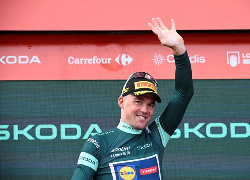 Team Lidl-Trek's Danish rider Mads Pedersen wearing the points ranking leader's green jersey celebrates on the podium after the 15th stage of the Vuelta a Espana cycling tour, a 167 km race between A Veiga/Vegaredo and Monforte de Lemos, on September 7, 2025.    Miguel RIOPA / AFP