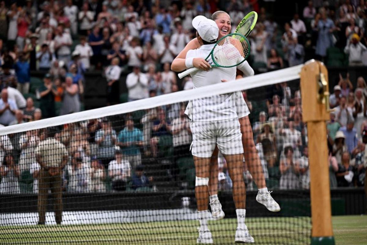 El Salvador's Marcelo Arevalo and Latvia's Jelena Ostapenko celebrate winning against Australia's players Marc Polmans and Storm Hunter during their mixed's doubles final tennis match on the eleventh day of the 2026 Wimbledon Championships at The All England Lawn Tennis and Croquet Club in Wimbledon, southwest London, on July 9, 2025.  Kirill KUDRYAVTSEV / AFP
