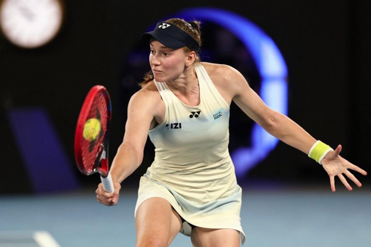 Kazakhstan's Elena Rybakina hits a return against USA's Jessica Pegula during their women's singles semi-final match on day twelve of the Australian Open tennis tournament in Melbourne on January 29, 2026.  IZHAR KHAN / AFP