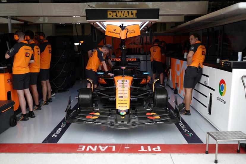 McLaren technicians work on the car of McLaren's Australian driver Oscar Piastri during a practice session for the 2025 Miami Formula One Grand Prix at Miami International Autodrome in Miami Gardens, Florida, on May 2, 2025.   CHARLY TRIBALLEAU / AFP