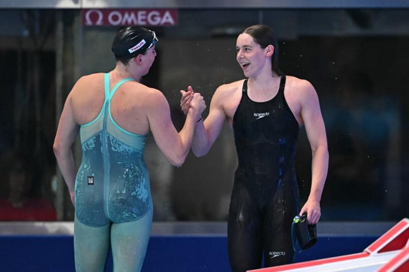 Belgium's swimmer Roos Vanotterdijk (R) reacts after a semi-final of the women's 50m butterfly swimming event during the 2025 World Aquatics Championships in Singapore on August 1, 2025.  MANAN VATSYAYANA / AFP