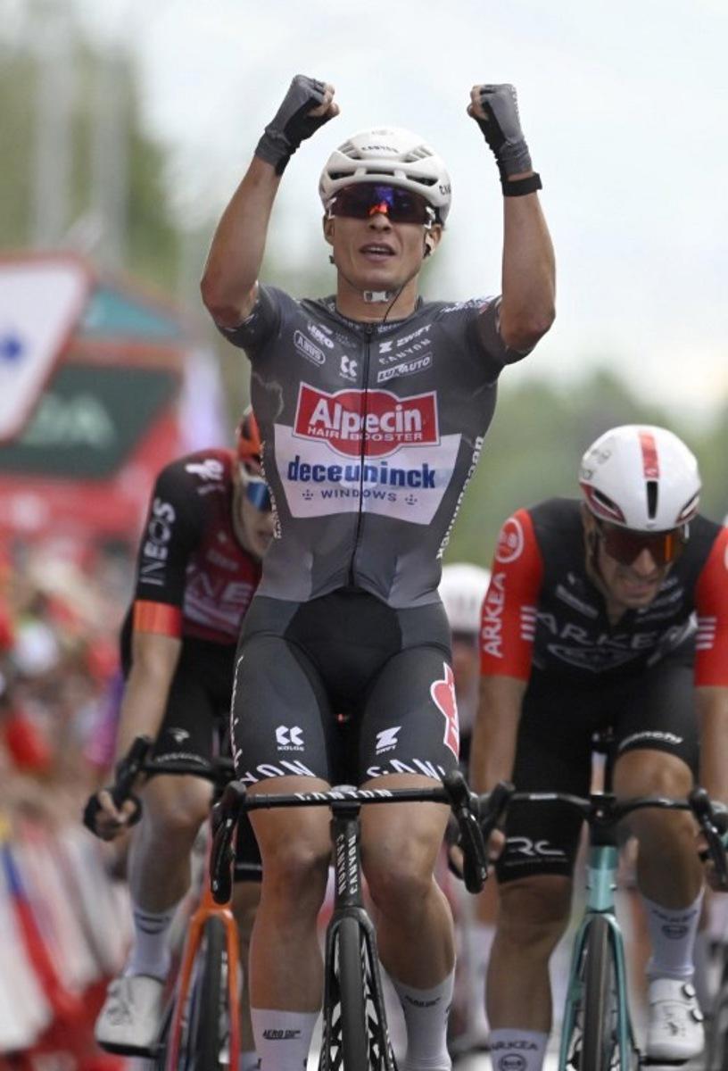 Team Alpecin's Belgian rider Jasper Philipsen celebrates crossing first the finish line of the 19th stage of the Vuelta a Espana, a 159 km race between Rueda and Guijuelo, in Medina del Campo on September 12, 2025.    Miguel RIOPA / AFP
