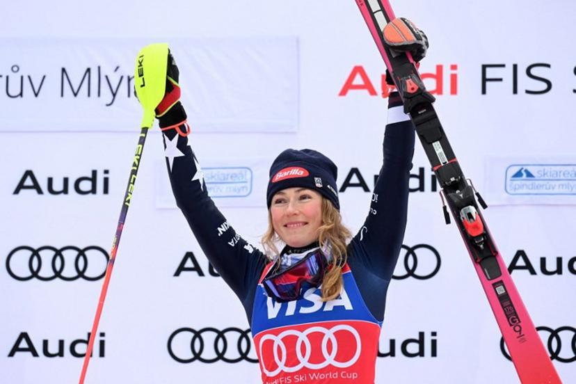 Winner US' Mikaela Shiffrin celebrates on the podium after the Women' Slalom event of FIS Alpine Skiing World Cup in Spindleruv Mlyn, Czech Republic on January 25, 2026.   Michal Cizek / AFP