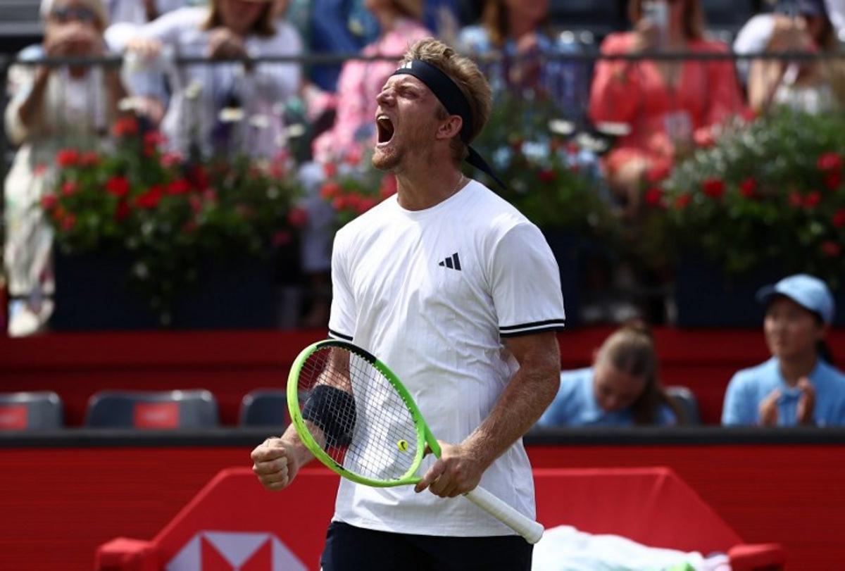 Spain's Alejandro Davidovich Fokina celebrates winning against  France's Corentin Moutet in their men's singles round of 16 tennis match on day three of the ATP HSBC Championships at Queen's Club in west London on June 18, 2026. Fokina won the match 6-4, 6-3. Henry NICHOLLS / AFP