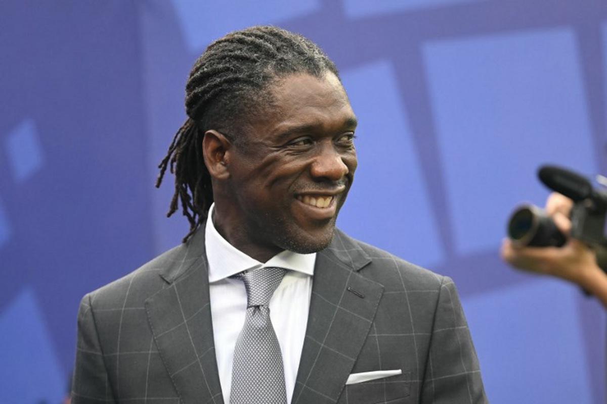 (FILES) Former Dutch football player Clarence Seedorf attends the 2026 World Cup round of 16 football match between Brazil and Norway at the New York/New Jersey Stadium in East Rutherford on July 5, 2026. Brazilian club Corinthians announced on October 11, 2026, the arrival of former Netherlands midfielder Clarence Seedorf as coach until the end of 2027 as they attempt to avoid relegation.  MAURO PIMENTEL / AFP
