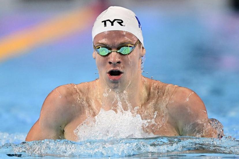 France's swimmer Leon Marchand competes in a heat of the men's 200m individual medley swimming event during the 2025 World Aquatics Championships in Singapore on July 30, 2025.  MANAN VATSYAYANA / AFP