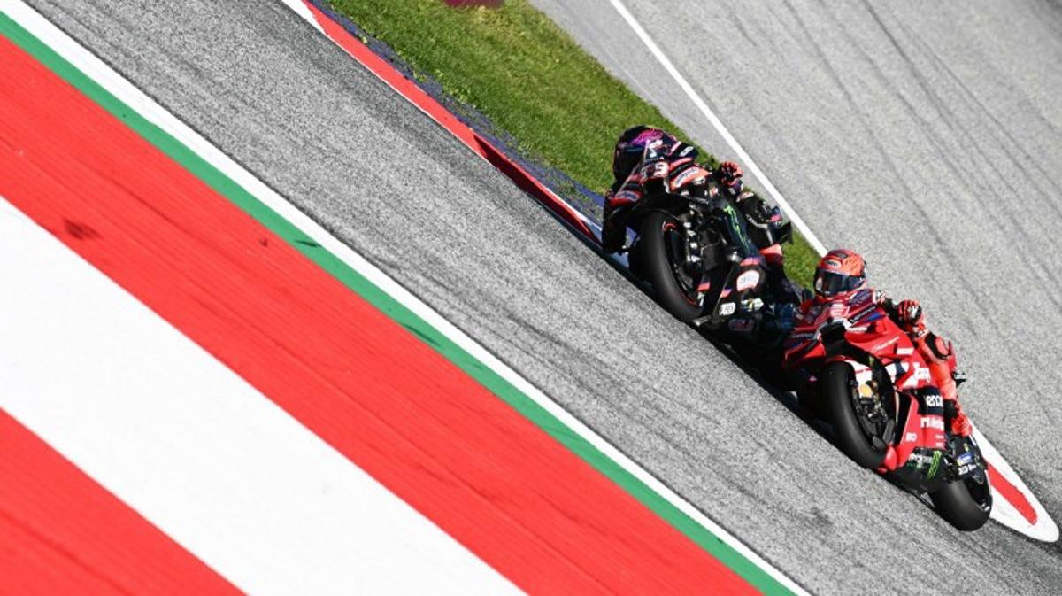 Aprilia Racing's Spanish driver Jorge Martin (L) and Ducati Lenovo Team's Spanish driver Marc Marquez compete during the Sprint event of the Grand Prix of Austria MotoGP in Spielberg bei Knittelfeld, Austria, on September 19, 2026.  Joe Klamar / AFP