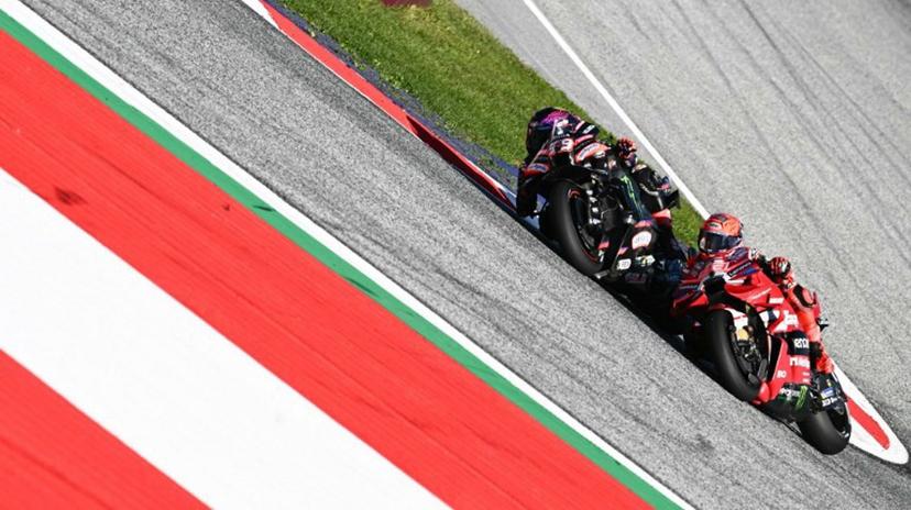 Aprilia Racing's Spanish driver Jorge Martin (L) and Ducati Lenovo Team's Spanish driver Marc Marquez compete during the Sprint event of the Grand Prix of Austria MotoGP in Spielberg bei Knittelfeld, Austria, on September 19, 2026.  Joe Klamar / AFP