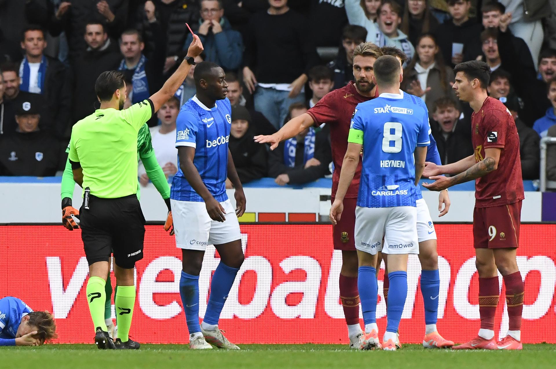 Dender's David Toshevski receives a red card from the referee during a soccer match between KRC Genk and FCV Dender EH, Sunday 05 October 2025 in Genk, a game of day 10 of the 2025-2026 'Jupiler Pro League' first division of the Belgian championship. BELGA PHOTO JILL DELSAUX
