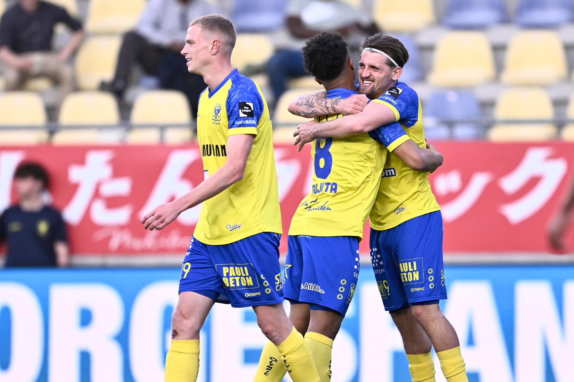 STVV's Joel Fujita and STVV's Adriano Bertaccini celebrate after scoring during a soccer match between Sint-Truidense VV and Cercle Brugge, Saturday 12 April 2025 in Sint-Truiden, on day 3 (out of 6) of the Relegation Play-offs of the 2024-2025 'Jupiler Pro League' first division of the Belgian championship. BELGA PHOTO JOHAN EYCKENS