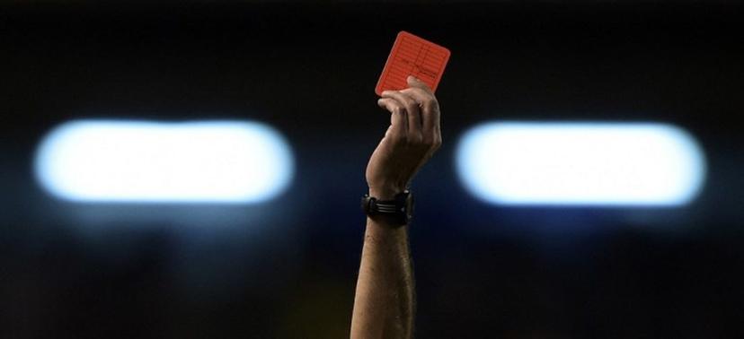 The hand of Argentine referee Diego Abal showing  the red card to Rosario Central's defender Lucas Acevedo (not in frame) during their Copa Sudamericana 2014 second round second leg football match against Boca Juniors at the Bombonera stadium in Buenos Aires, Argentina, on September 18, 2014. AFP PHOTO / Juan Mabromata  Juan MABROMATA / AFP