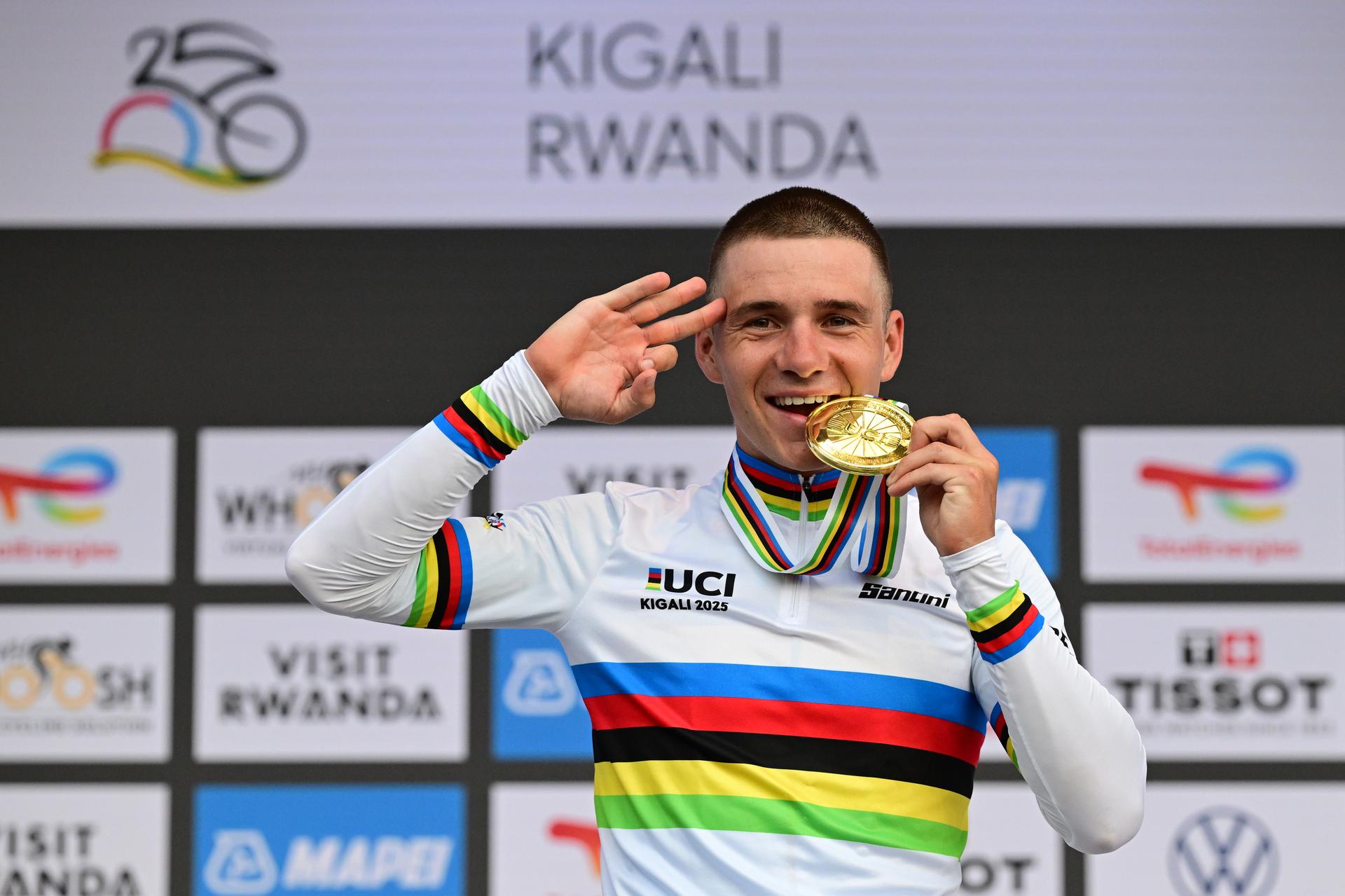 Belgian Remco Evenepoel celebrates and shows the number of his victories, three on a row, on the podium of the Men Elite Individual Time Trial race (40,8km) at the cycling road world championships, in Kigali, Rwanda, Sunday 21 September 2025. The 2025 UCI Road World Championships take place from 21 to 28 September in Kigali, Rwanda. BELGA PHOTO DIRK WAEM