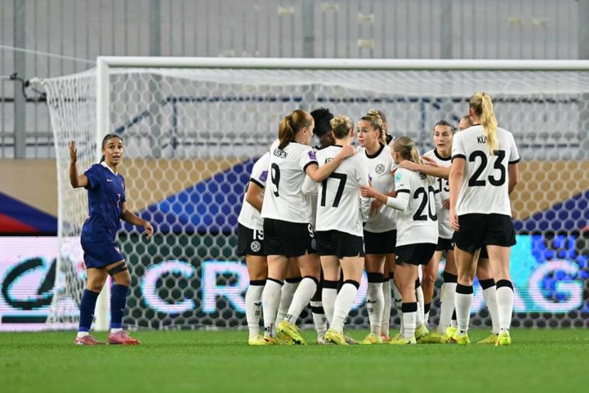 Germany's players celebrate after scoring Germany's first goal during the UEFA Women's Nations League semi-final football match between France and Germany at the Michel-d'Ornano Stadium in Caen, northwestern France, on October 28, 2025.  LOU BENOIST / AFP