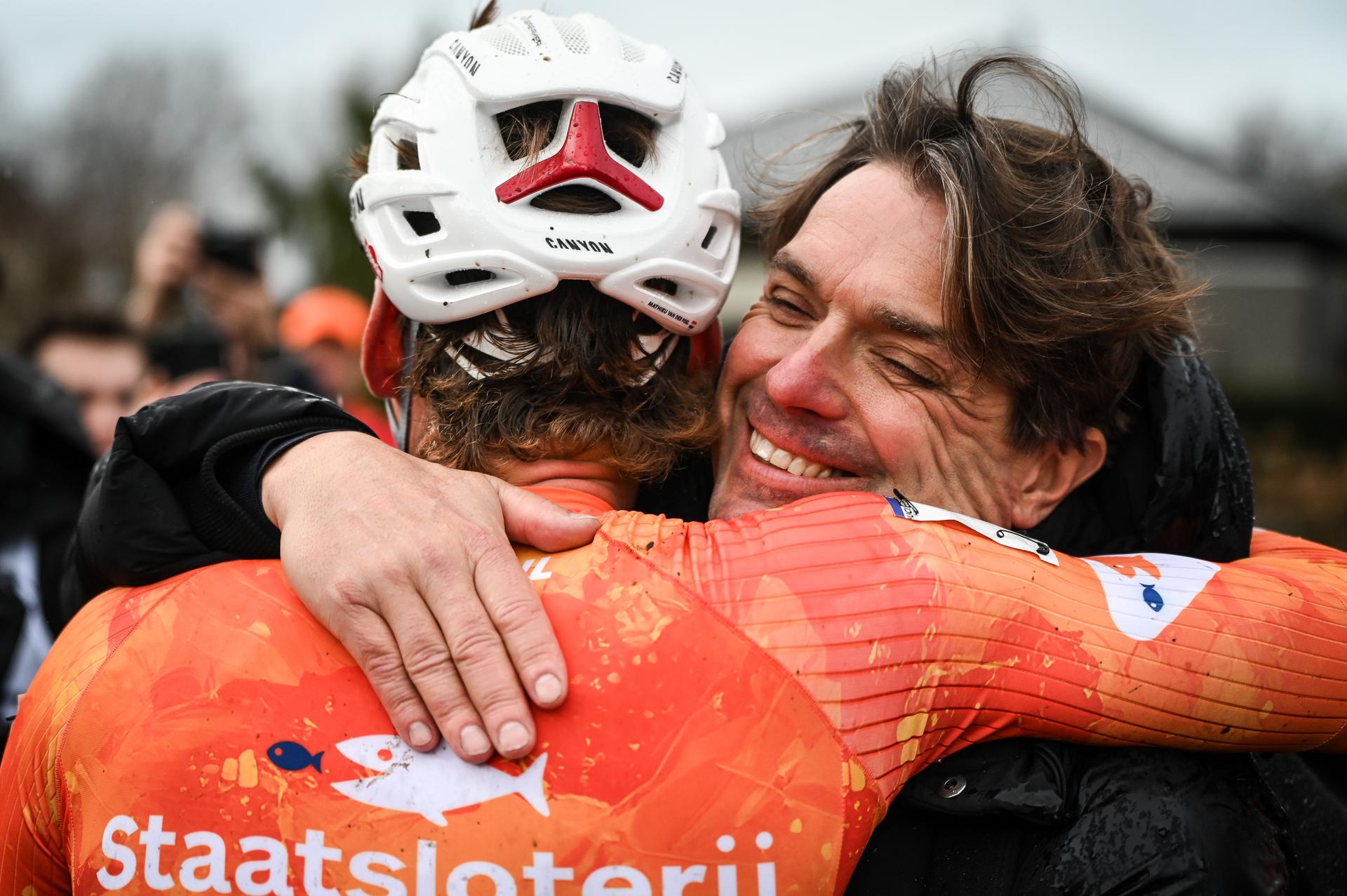 Dutch Mathieu van der Poel hugs his coach Christophe Roodhooft after the men elite race at UCI Cyclocross World Championships, on Sunday 01 February 2026, in Hulst, The Netherlands. BELGA PHOTO ELIAS ROM