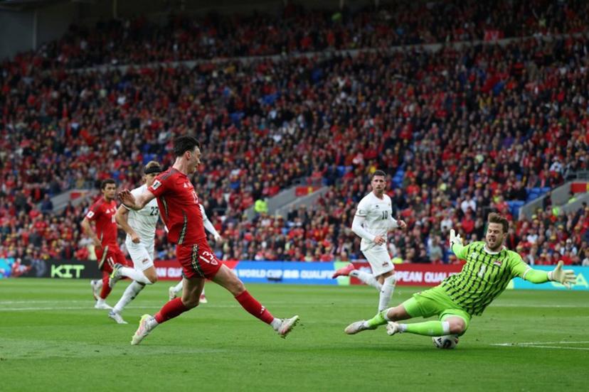 Liechtenstein's goalkeeper #01 Benjamin Buchel saves this shot from Wales' forward #13 Kieffer Moore (L) during the 2026 World Cup Group J qualifier football match between Wales and Liechtenstein, at Cardiff City Stadium, in Cardiff, on June 6, 2025.   Darren Staples / AFP