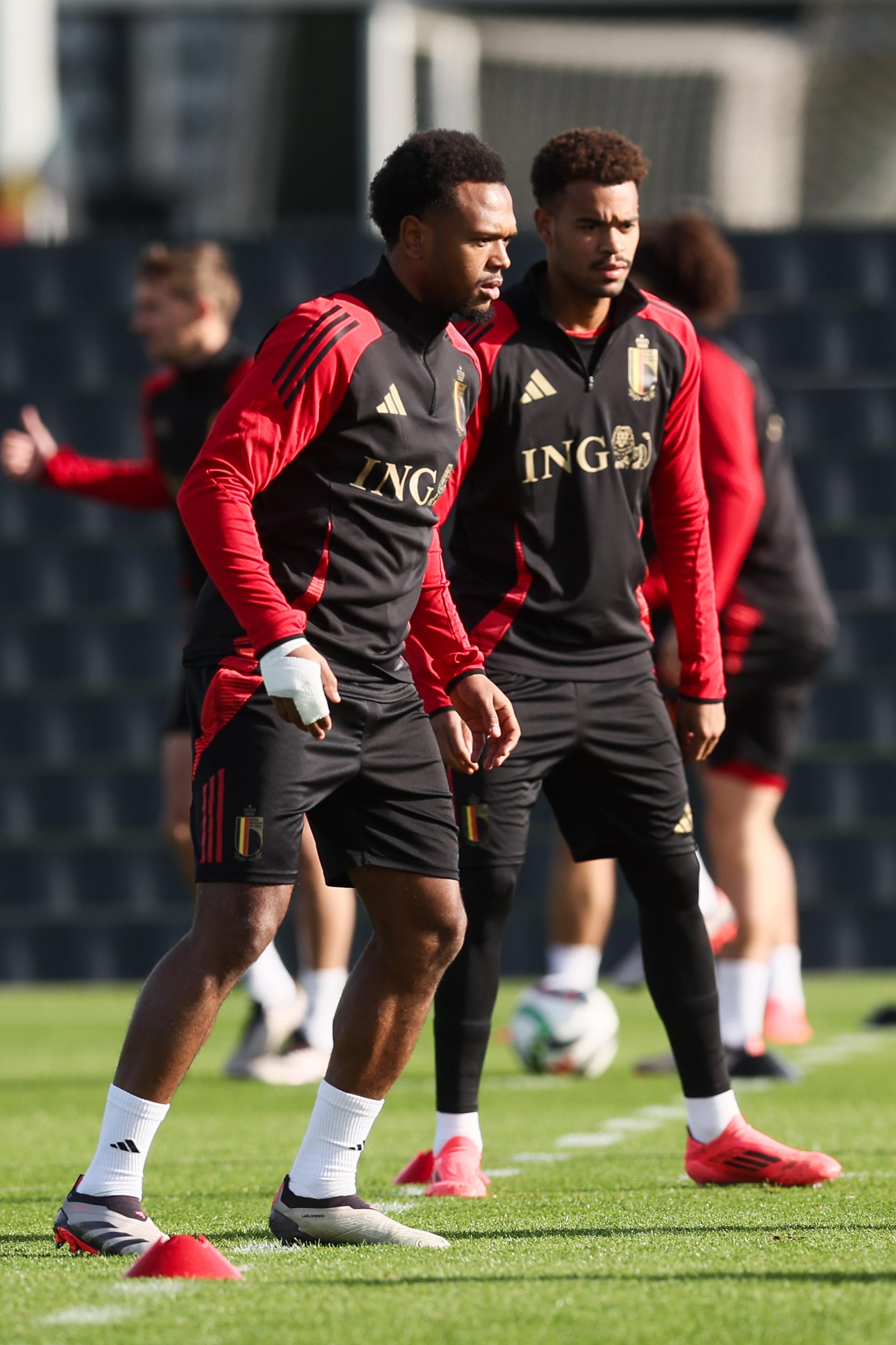 Belgium's Lois Openda and Belgium's Cyril Ngonge pictured during a training session of the Belgian national soccer team Red Devils, at the Royal Belgian Football Association's training center, in Tubize, Sunday 13 October 2024. The Red Devils are playing against France on Monday, for the UEFA Nations League 2025. BELGA PHOTO BRUNO FAHY