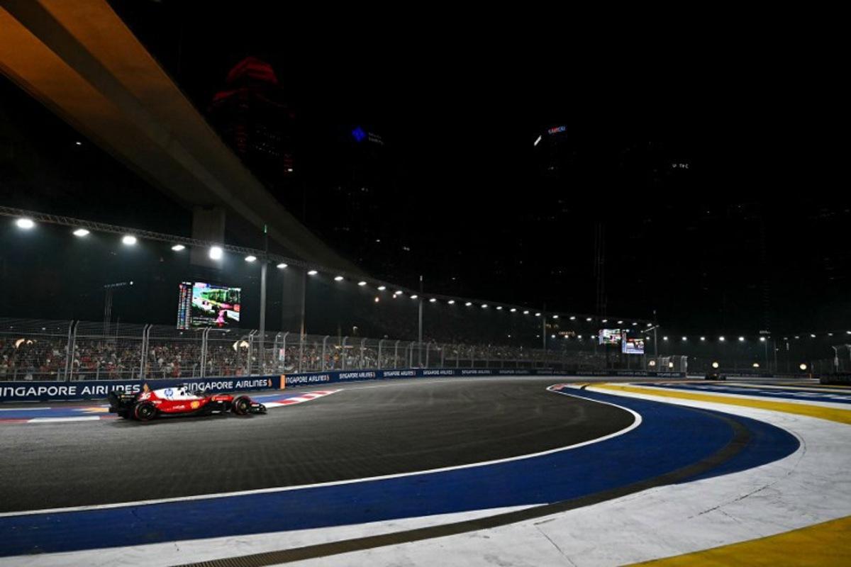 Ferrari's Monegasque driver Charles Leclerc drives during the Formula One Singapore Grand Prix at the Marina Bay Street Circuit in Singapore on October 11, 2026.  Lillian SUWANRUMPHA / AFP