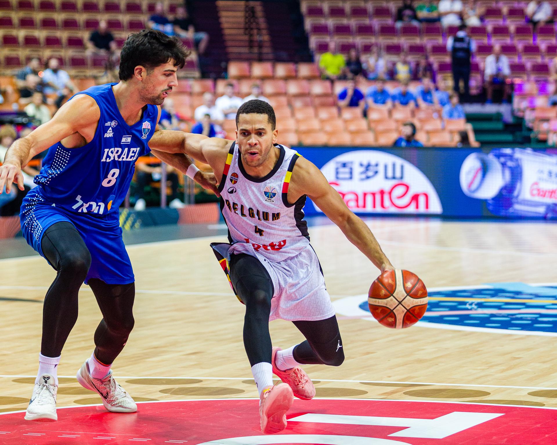 Israeli Deni Avdija and Belgium's Emmanuel Manu Lecomte pictured in action during a basketball match between Belgium's national team Belgian Lions and Israel, Tuesday 02 September 2025 in Katowice, Poland, the fourth game of the group stage of the Eurobasket 2025 European championships, in the group D. BELGA PHOTO PAWEL PIETRANIK *** BELGIUM ONLY ***