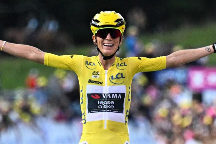 Overall leader's yellow jersey Team Visma | Lease a Bike's French rider Pauline Ferrand-Prevot celebrates as she crosses the finish line to win the 9th and final stage (out of 9) and the fourth edition of the Women's Tour de France cycling race, 124.1 km from Praz-sur-Arly to Chatel, in Chatel eastern France, on August 3, 2025.  JULIEN DE ROSA / AFP