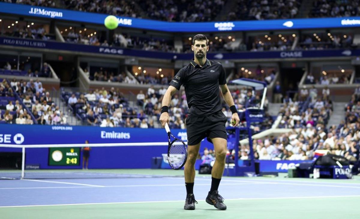 Serbia's Novak Djokovic eyes the ball during the men's singles quarterfinal tennis match against USA's Taylor Fritz  on day ten of the US Open tennis tournament at the USTA Billie Jean King National Tennis Center in New York City, on September 2, 2025.  CHARLY TRIBALLEAU / AFP