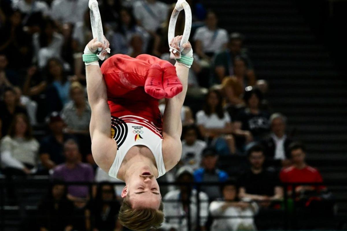 Belgium's Glen Cuyle competes in the artistic gymnastics men's rings final during the Paris 2024 Olympic Games at the Bercy Arena in Paris, on August 4, 2024.  Loic VENANCE / AFP