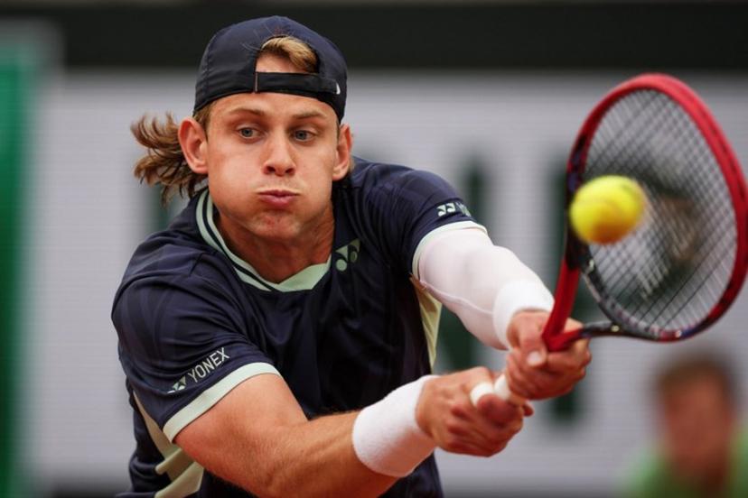 Belgium's Zizou Bergs plays a forehand return to France's Giovanni Mpetshi Perricard during their men's singles match on day 1 of the French Open tennis tournament on Court Suzanne-Lenglen at the Roland-Garros Complex in Paris on May 25, 2025.  Dimitar DILKOFF / AFP