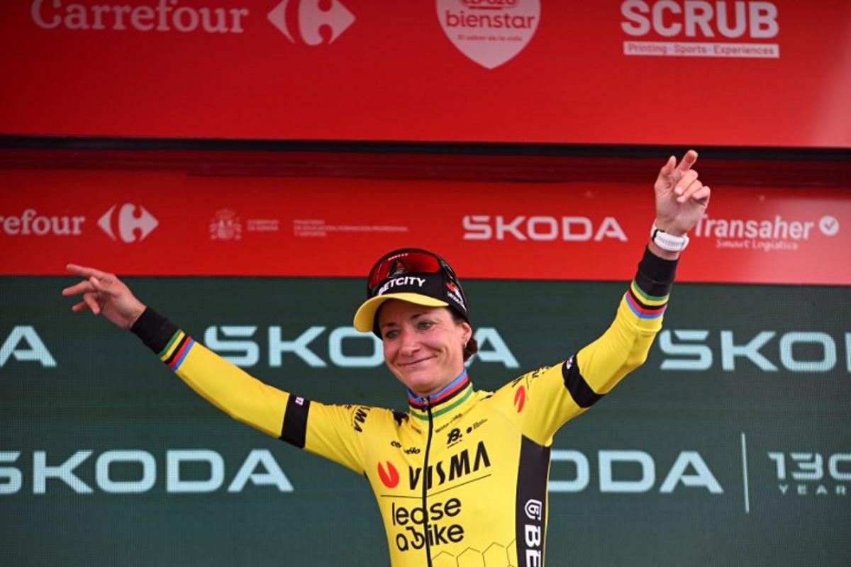 Points ranking leader Team Visma-Lease a Bike's Dutch rider Marianne Vos celebrates on the podium after the 7th stage of the 2025 La Vuelta Femenina cycling tour of Spain, a 152.6 km race from La Robla to Cotobello, on May 10, 2025.  MIGUEL RIOPA / AFP