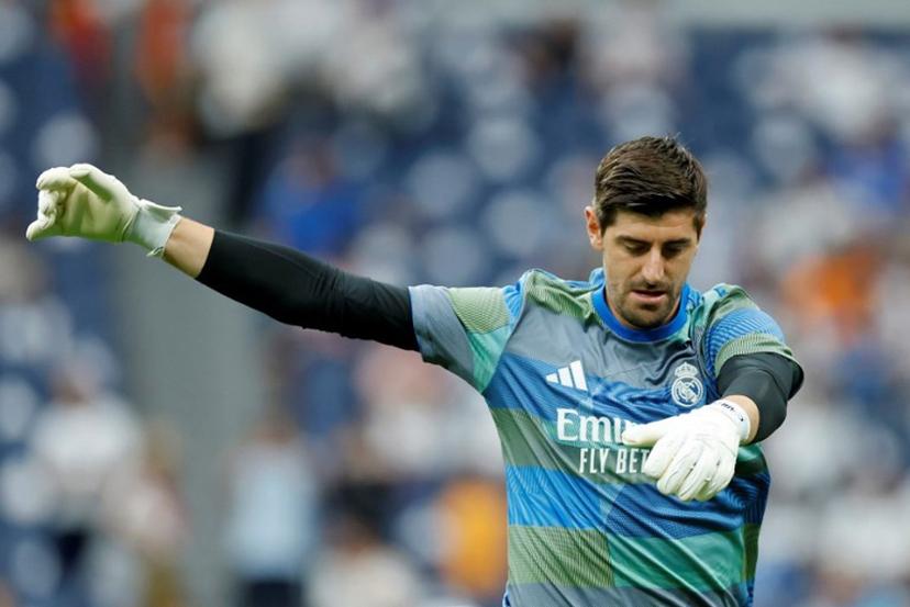 Real Madrid's Belgian goalkeeper #01 Thibaut Courtois warms up prior the Spanish league football match between Real Madrid CF and RCD Espanyol at the Santiago Bernabeu stadium in Madrid on September 20, 2025.  Oscar DEL POZO / AFP