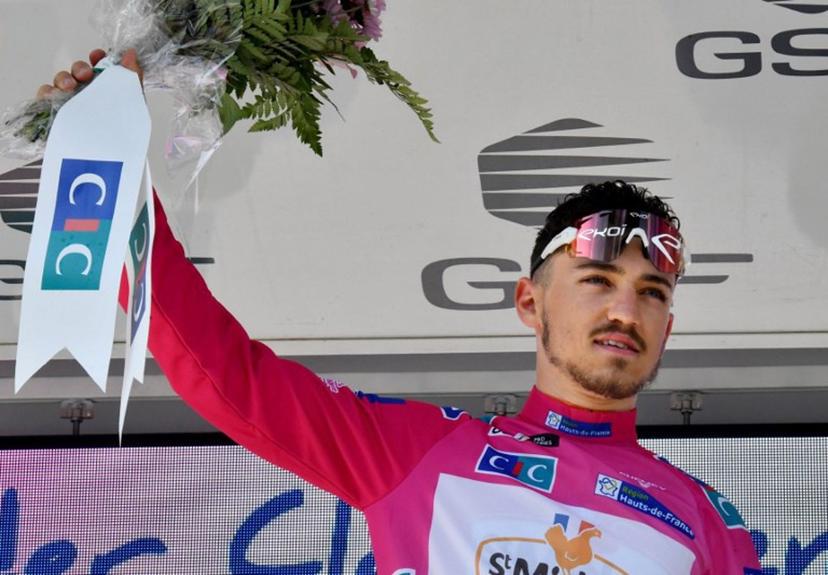 Team St Michel-Auber 93's Jason Tesson of France celebrates on the podium after winning the second stage of the "4 jours de Dunkerque" (Four days of Dunkirk) cycling race and taking the lead in the general classification, in Maubeuge, Northern France, on May 4, 2022.  FRANCOIS LO PRESTI / AFP