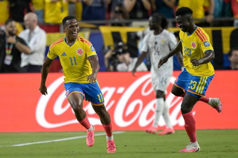 Colombia's midfielder #11 Jhon Arias (R) celebrates scoring his team's first goal with  defender #23 Davinson Sanchez during the 2026 World Cup round of 32 football match between Colombia and Ghana at the Kansas City Stadium in Kansas City on July 3, 2026.   JUAN MABROMATA / AFP