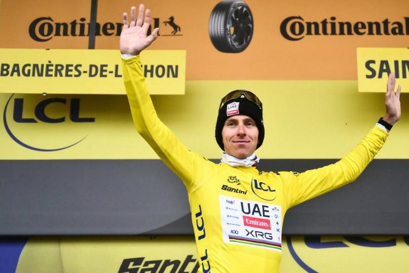 UAE Team Emirates - XRG team's Slovenian rider Tadej Pogacar celebrates on the podium with the overall leader's yellow jersey after the 14th stage of the 112th edition of the Tour de France cycling race, 182.6 km between Pau and Luchon-Superbagneres, in the Pyrenees mountains of southwestern France, on July 19, 2025.  Marco BERTORELLO / AFP