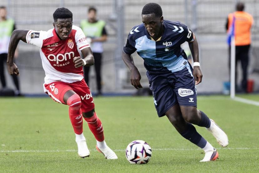Le Havre's Senegalese midfielder #14 Rassoul Ndiaye (R) fights for the ball with Monaco's French midfielder #08 Lamine Camara during the French L1 football match between Le Havre AC and AS Monaco at the Stade Oceane in Le Havre, northwestern France on August 23, 2026.  Fred TANNEAU / AFP