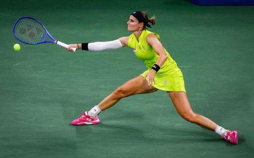 Belgium's Greet Minnen returns the ball to Japan's Naomi Osaka during their women's singles first round tennis match on day three of the US Open tennis tournament at the USTA Billie Jean King National Tennis Center in New York City, on August 26, 2025.  Kena Betancur / AFP