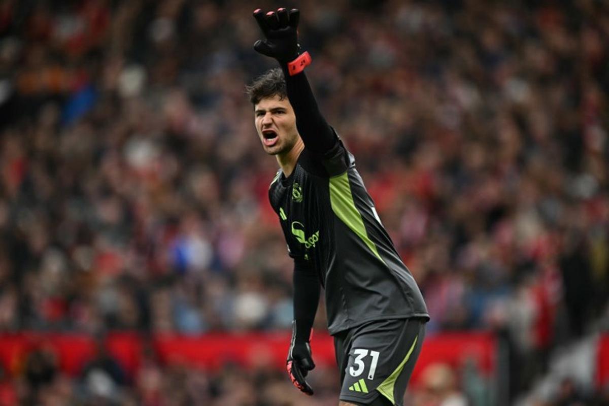 Manchester United's Belgian goalkeeper #31 Senne Lammens gestures during the English Premier League football match between Manchester United and Sunderland at Old Trafford in Manchester, north west England, on October 4, 2025.  Paul ELLIS / AFP