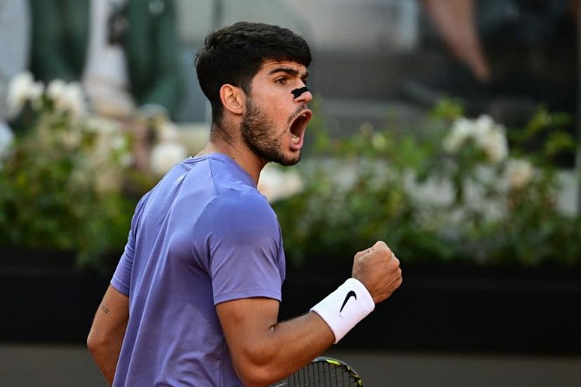 Spain's Carlos Alcaraz reacts during his men's singles final match against Italy's Jannik Sinner for the ATP Rome Open tennis tournament at Foro Italico in Rome on May 18, 2025.   Tiziana FABI / AFP