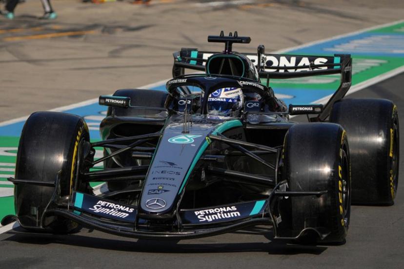 Mercedes' British driver George Russell drives in the pit lane during the sprint qualifying session ahead of the Formula One Chinese Grand Prix at the Shanghai International Circuit in Shanghai on March 13, 2026.  Andy WONG / POOL / AFP