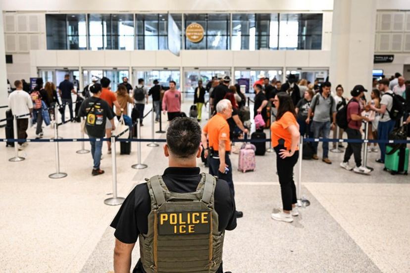 US Immigration and Customs Enforcement (ICE) are seem at George Bush Intercontinental Airport in Houston, Texas on March 23, 2026.  RONALDO SCHEMIDT / AFP
