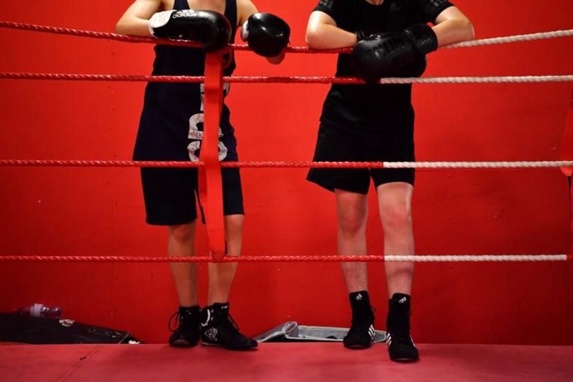 Young boxers take a break during a training session at the Box Clever Sports club in Ladbroke Grove, west London on June 8, 2018.  The iconic Dale Youth boxing club has picked itself off the canvas since being gutted in the Grenfell Tower fire that killed 71 people and become an unlikely sanctuary for those affected. BEN STANSALL / AFP