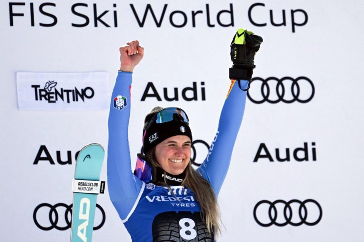 Italy's Laura Pirovano celebrates on the podium after winning the Women's Downhill race of the FIS Ski World Cup at the La Volata slope in the Passo San Pellegrino ski area, Val di Fassa, Italy on March 6, 2026.  Andreas SOLARO / AFP
