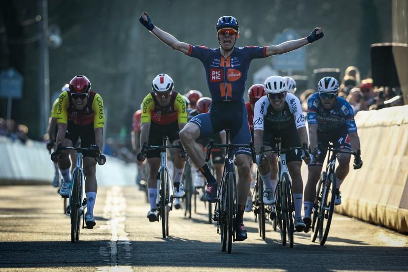 Dutch Nils Eekhoff of Team Picnic PostNL celebrates as he crosses the finish line to win the 'Nokere Koerse' one day cycling race for men elite, 188.1 km from Deinze to Nokere, on Wednesday 19 March 2025. BELGA PHOTO DAVID PINTENS