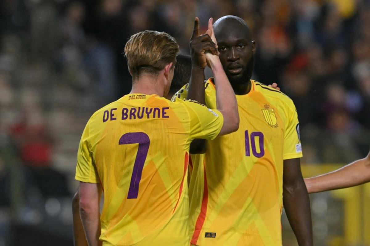 Belgium's forward #10 Romelu Lukaku celebrates with Belgium's midfielder #07 Kevin De Bruyne (L) after scoring Belgium's fourth goal during the FIFA World Cup 2026 Group J European qualification football match between Belgium and Wales at the King Baudouin Stadium in Brussels, on June 9, 2025.  NICOLAS TUCAT / AFP